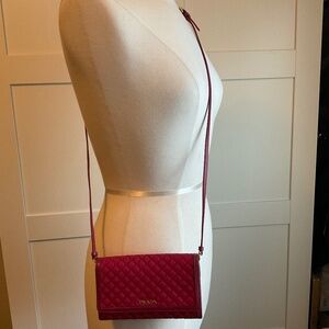 Prada fuchsia pink quilted wallet on crossbody strap